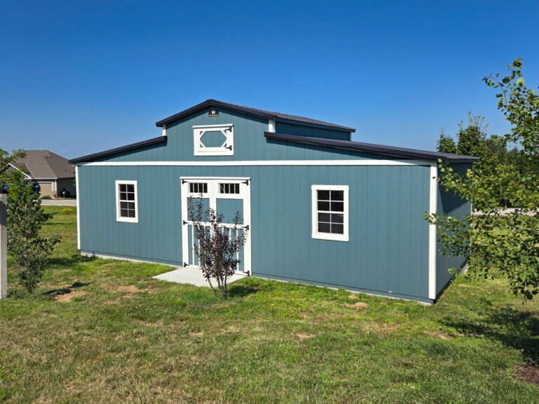 Country Barn blue metal siding metal roof with white trim