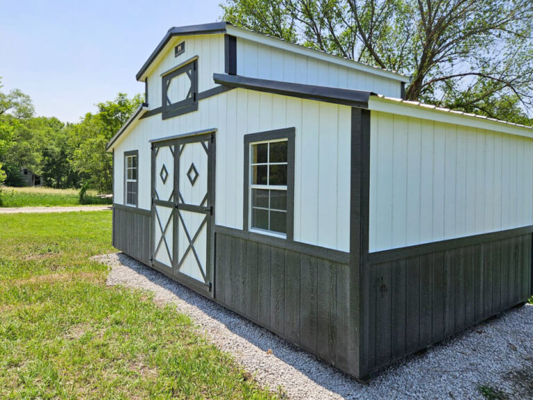 Country Barn white metal siding metal roof and black trim corner view