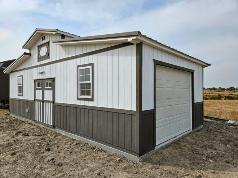 Country Barn white metal siding metal roof dark trim and garage door