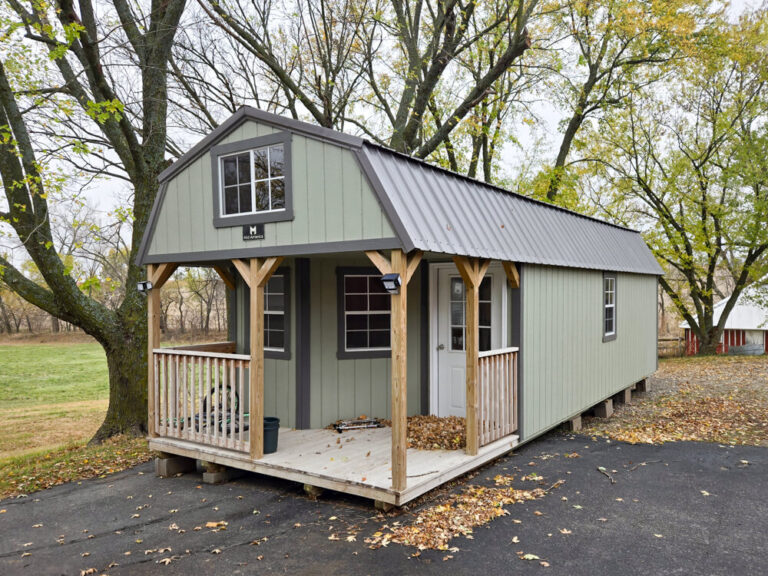 Deluxe Cabin light green siding with brown metal roof