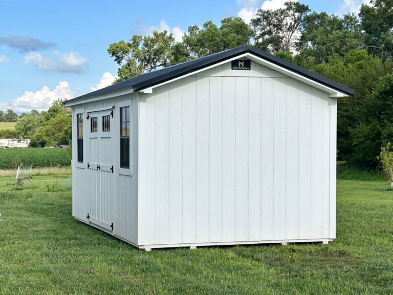 Garden Shed white siding and trim with black metal roof and windows
