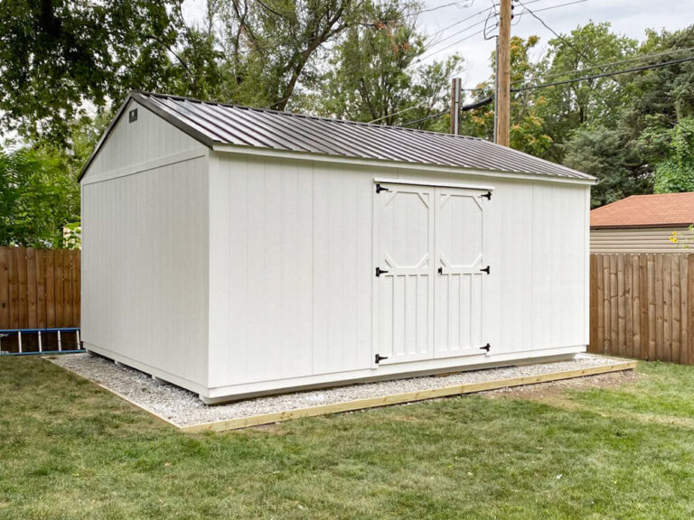 Garden Shed white siding and trim with black metal roof without windows