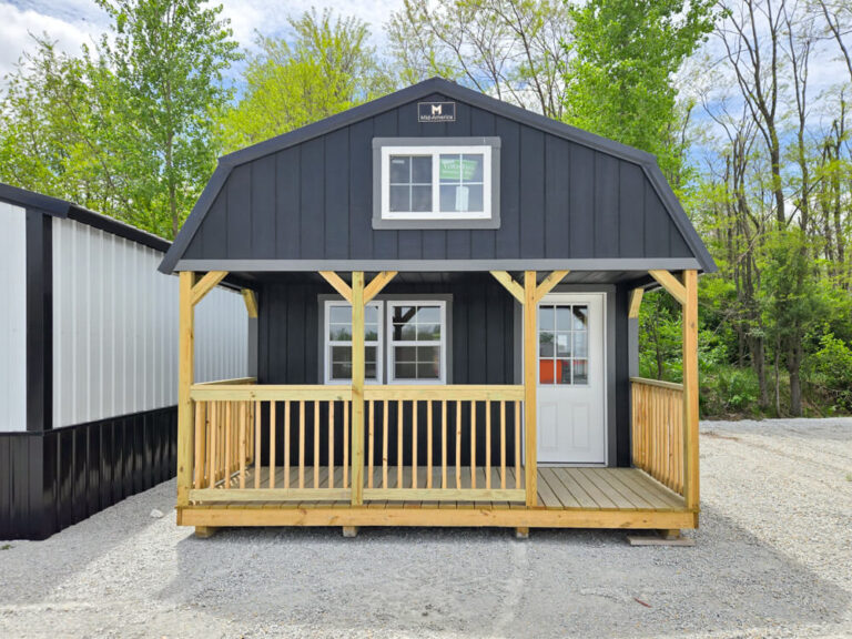 Lofted Cabin front view with porch and wooden railing