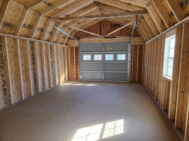 Lofted Garage interior view facing garage door