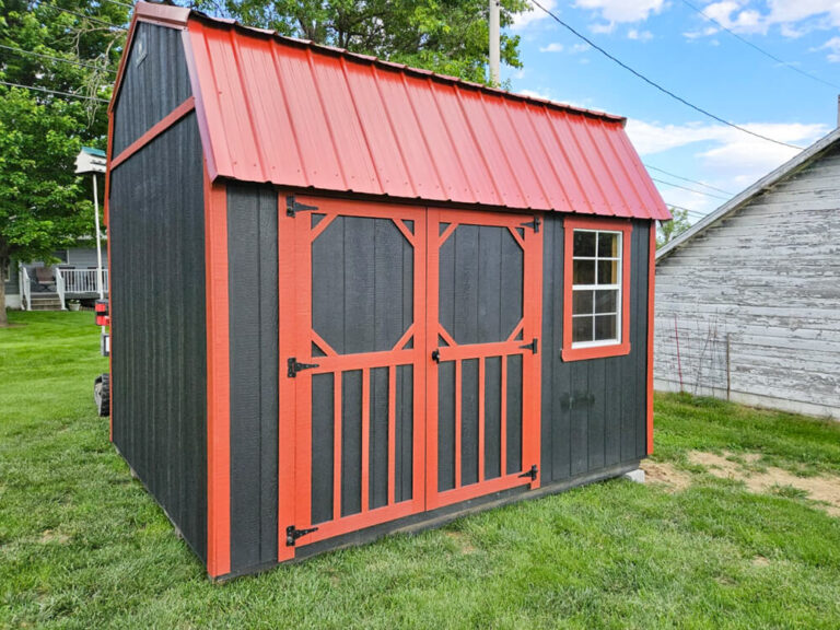 Lofted Garden Shed dark gray siding with orange trim and metal roof