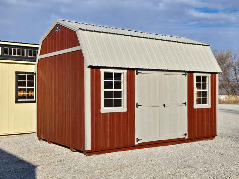 Lofted Garden Shed red siding with tan trim and metal roof