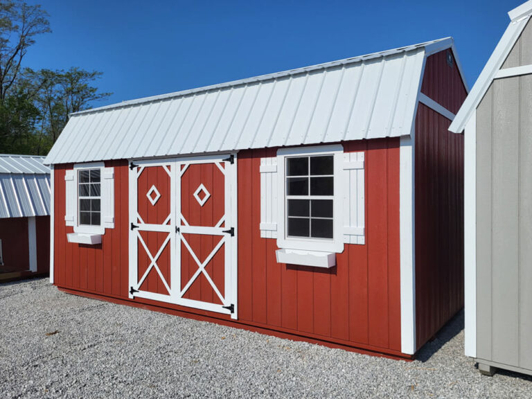 Lofted Garden Shed red siding with white trim and metal roof