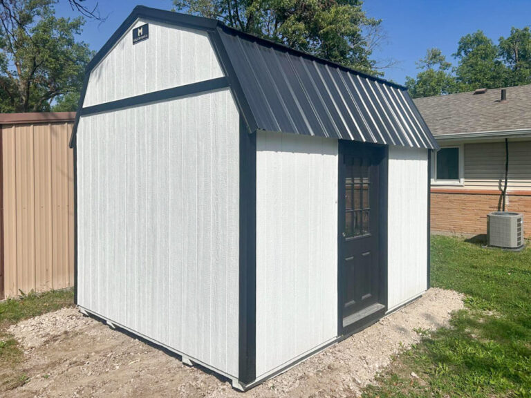 Lofted Garden Shed white siding with back trim and metal roof