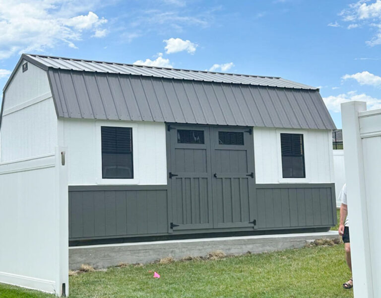 Lofted Garden Shed white siding with dark siding and metal roof