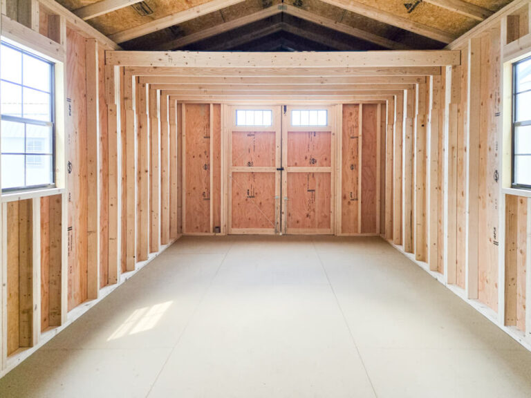 Lofted Utility Shed inside view looking towards double swinging doors