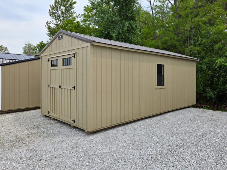 Lofted Utility Shed tan siding and trim with metal roof