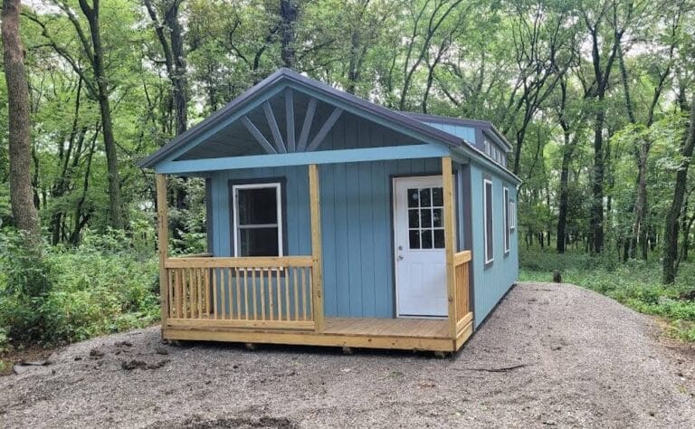 Front view of pre-built Swiss Cabin in blue and gray