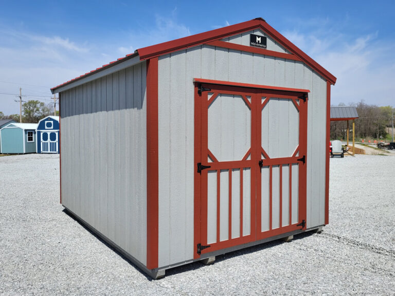 Utility Shed gray with red trim and metal roof