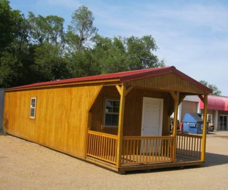 Stained Portable Cabin with a red metal roof