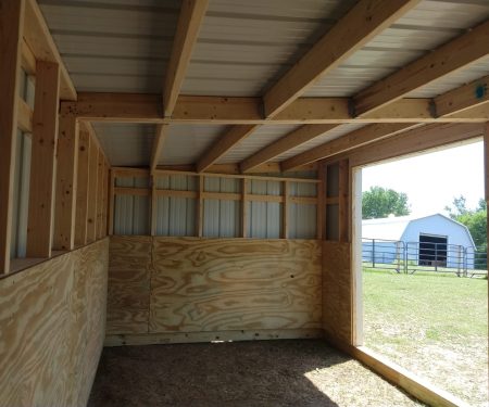 Pre-built Animal Shelters - finished interior of loafing shed in pasture.