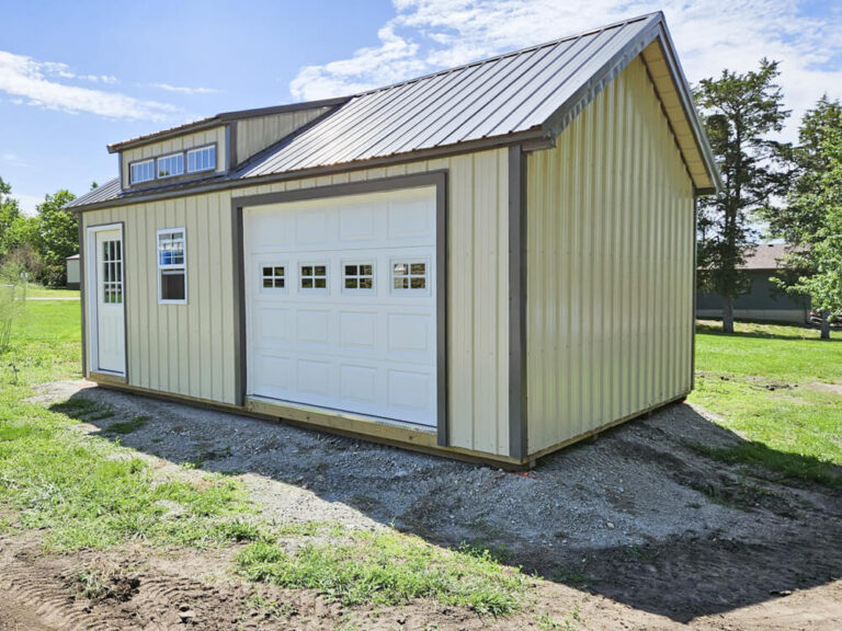 Legacy Garage tan metal siding with dark metal roof and trim with transom window on roof