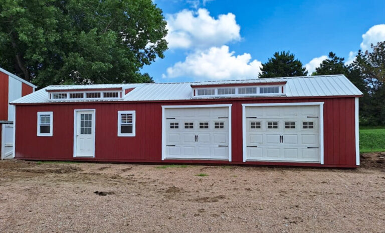 Legacy Garage two car garage and single man door red metal siding white trim metal roof