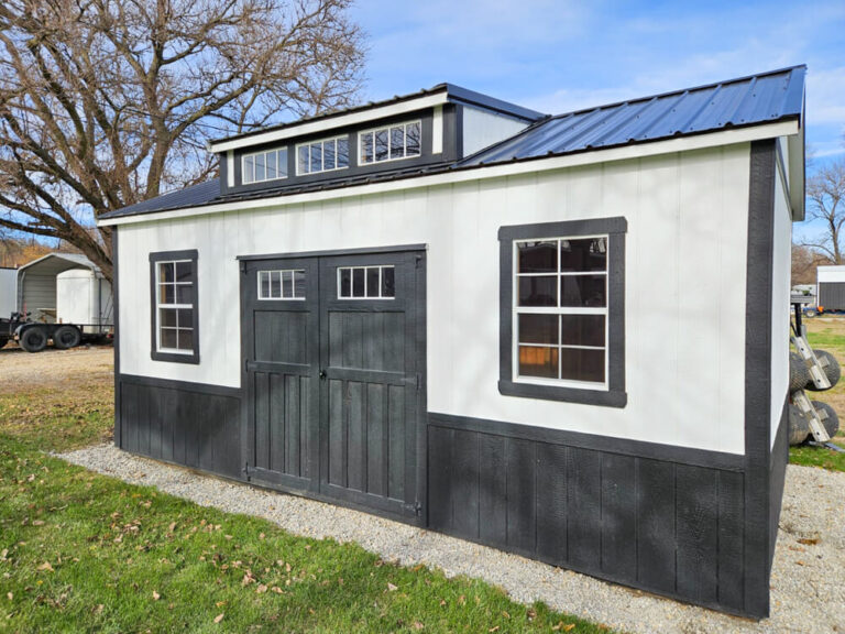 Villa white siding black trim and metal roof black double man doors