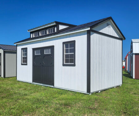 white villa shed with black roof and trim