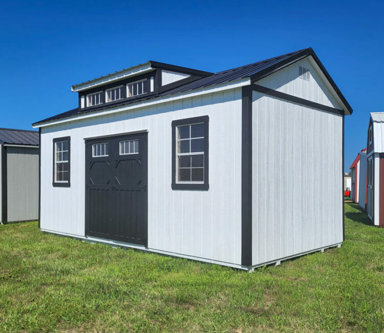 white villa shed with black roof and trim