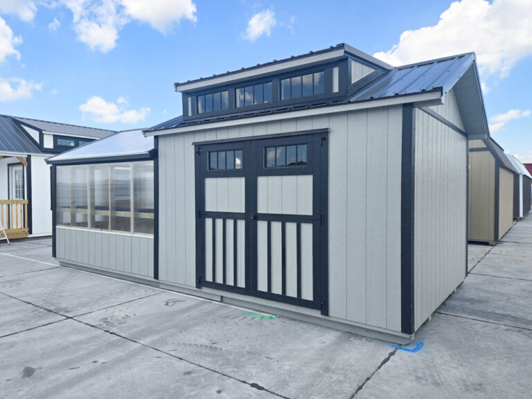 Greenhouse Shed Combo light tan siding dark trim with dark metal roof and transom window on roof