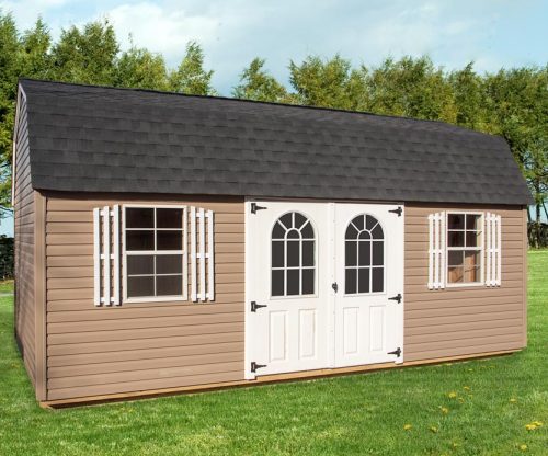Lofted Garden Shed by Mid-America Structures on a green lawn with tree line in background